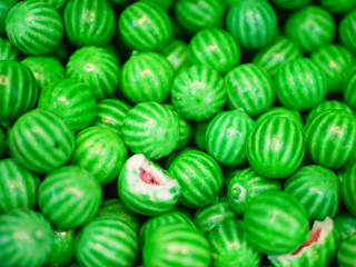 Sweets in the form of a watermelon. Multi-colored sweets. close-up. Children's sweets. The cause of childhood caries.