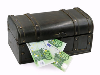 Treasure chest with hundred euro banknotes isolated on white background