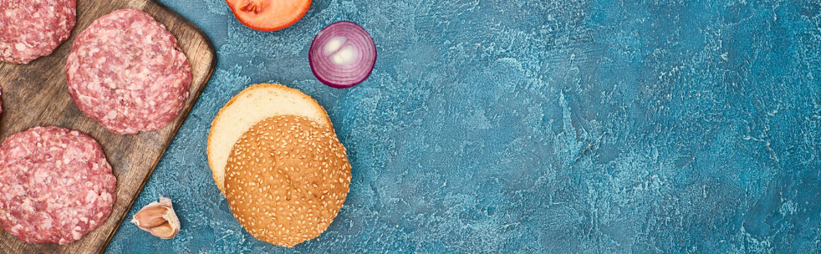 Top View Of Fresh Burger Ingredients On Blue Textured Surface With Copy Space, Panoramic Shot