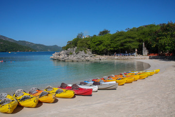 canoes that tourists on cruise boats can rent on the beach in Haiti