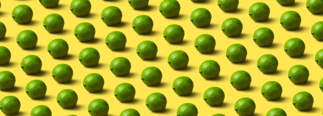 limes pattern on yellow  background, panoramic image