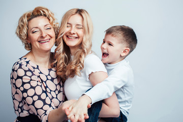 happy smiling blond family together posing cheerful on white background, generation concept. lifestyle people