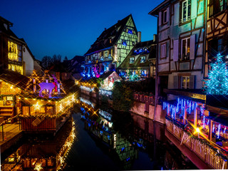 Christmas decorations on the streets of Colmar. Illuminated houses and New Year's fairy tale