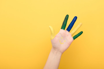 cropped view of woman showing colorful five fingers isolated on yellow
