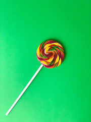colorful lollipop on green  background