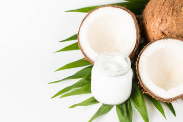 Ripe half cut coconut on a wooden background. Ripe half cut coconut on a wooden background. Coconut cream and oil.