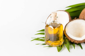 Ripe half cut coconut on a wooden background. Ripe half cut coconut on a wooden background. Coconut cream and oil.