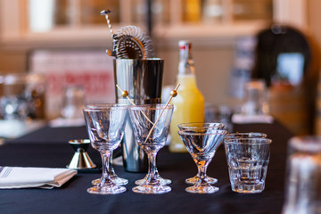 whisky and wine tasting table with stainless steel Martini picks arranged on top of a black cloth in a north Virginia distillery 