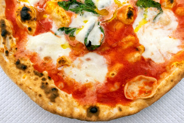 Top view of the classic Pizza Margherita, Italian restaurant menu.