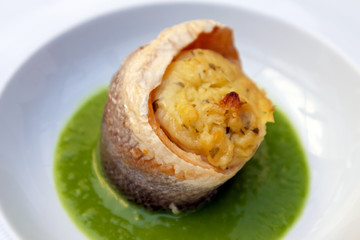 Sea bass with pea sauce, ready to eat.