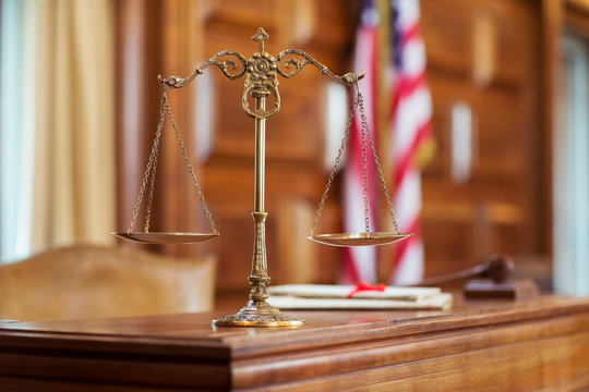 Scales of justice on the judge‚Äôs bench