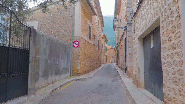 An empty street view of Sant Llorenç showing traditional Mallorcan village offers visitors impressive architecture as well as many great excursion possibilities and cultural attractions.
