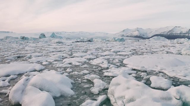 Aerial view of the J kuls rl n glacial lagoon and floating icebergs. The beginning of spring in Iceland