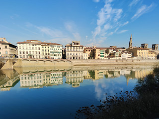 Fototapeta na wymiar Old buildings on the shore of Arno river