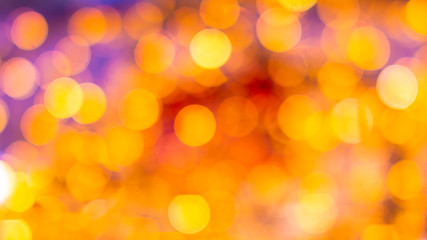 Gold yellow and red abstract background with bokeh defocused blurred lights