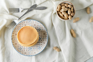 Composition with tasty pancakes on table
