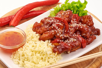 Kung Pao Chicken with rice prepared in wok, Chinese traditional food, isolated on white background
