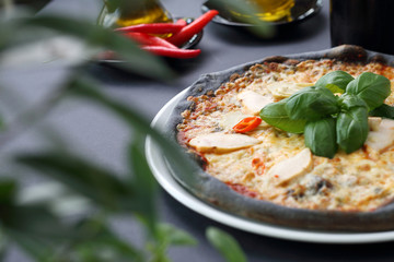 Pizza on black dough. Black pizza.Black food.