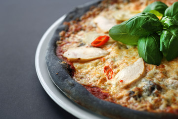 Pizza on black dough. Black pizza.Black food.