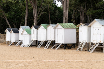 Obraz na płótnie Canvas Noirmoutier the Ladies Beach in Vendée white wood cabin for tourist