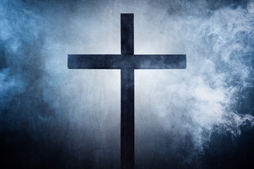holy cross on a foggy night