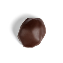 Chocolate candy with prunes on white, isolated