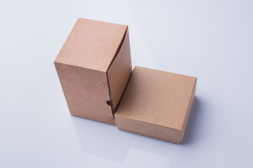 Small and tall cardboard boxes. Two boxes of different size, white isolated background.