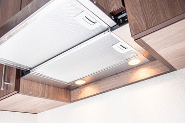 Design of a modern folding hood integrated into the kitchen hinged furniture. New fresh repair....