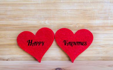 Happy Valentine's Greeting Card with Red Hearts on a  Wooden Background