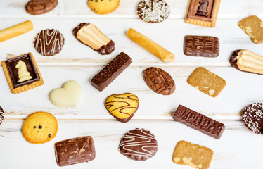 Many Different  Biscuits on a White Wooden Background