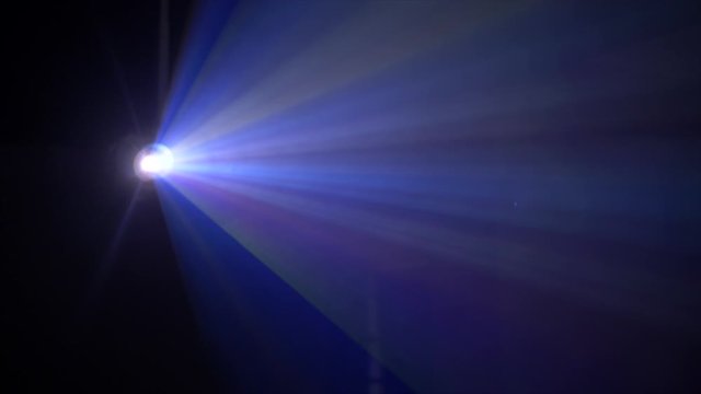 4K Shot Of Beautiful Big Rays Of Colours Shining Out Of Projector Surrounded By Smoke. Bright Light Shining In Different Direction. Blue And Pink Light Spinning Around Smoke Hitting It. Glare