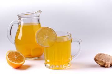 Homemade invigorating drink with lemon, ginger, honey and turmeric on a white background, Horizontal orientation, Closeup