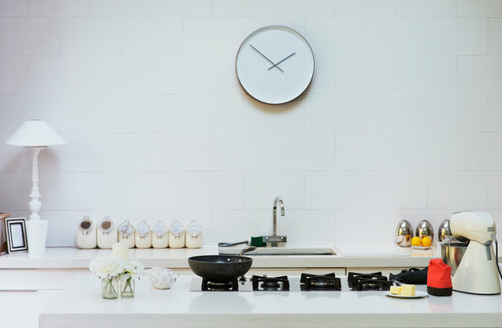 Modern Clock On Wall In Kitchen