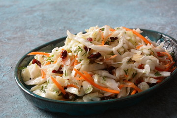Poached egg with green cucumber, arugula beet leaves , smoked salmon and spices on a toast, wooden background. Healthy French breakfast concept 