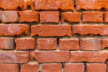 Obraz premium wall of old peeling red bricks