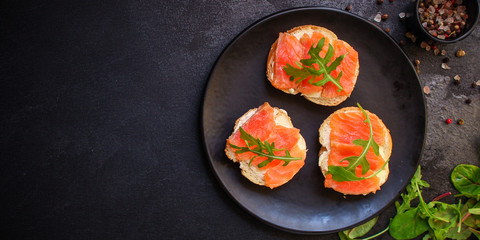 sandwich salmon smorrebrod (delicious snack seafood fish) menu concept. food background. top view. copy space
