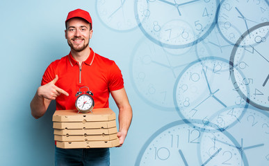 Deliveryman is punctual to deliver quickly pizzas. Cyan background