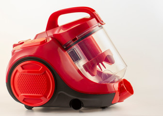 Red vacuum cleaner on a white background