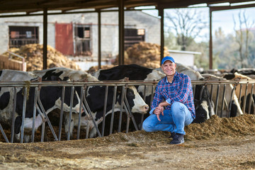 farmer at farm with dairy cow