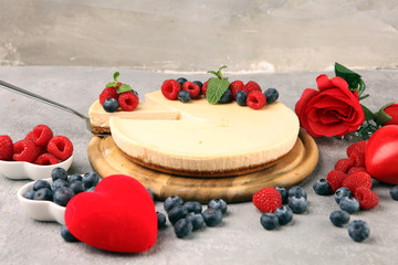 Homemade cheesecake with fresh raspberries and mint for valentines day - healthy organic summer dessert pie cheesecake. Vanilla Cheese Cake for dessert