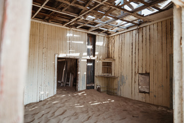 desert sand has invaded and taken over these rooms in Kolmanskoppe, Namibia