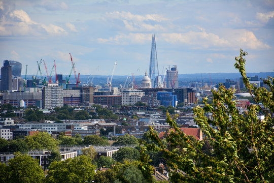 Skyline of Central London with the skyscrapers of the City of London, a financial district, and famous sights such as the Shard and St Paul's Cathedral, seen from Parliament Hill on Hampstead Heath