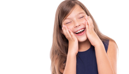 Little girl laughs closing her eyes isolated on a white background.
