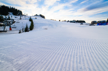 Skiing background - fresh snow on ski slope