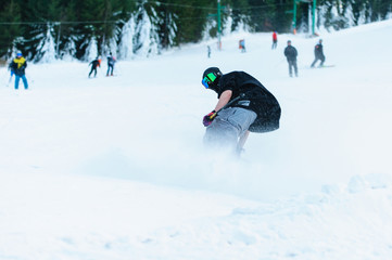 Male skier skiing on ski slope at Donovaly ski resort in Slovakia