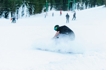 Male skier skiing on ski slope at Donovaly ski resort in Slovakia