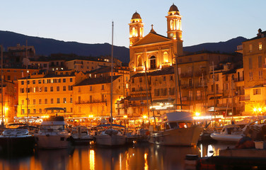 Fototapeta na wymiar View of St Jean Baptiste cathedral and old port of Bastia ,second largest corsican city and main entry point to the island