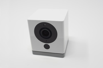 Obraz premium Indoor smart surveillance video camera. Small and modern home security recording device.