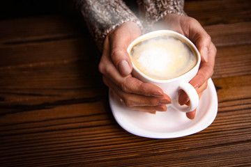 female hands and coffee