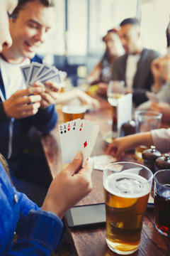 Woman Holding Aces Four Of A Kind Playing Poker Drinking Beer Friends At Bar